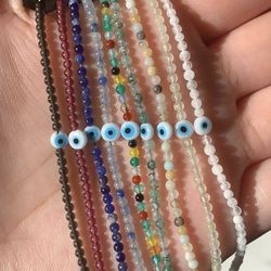 Gem stone evil eye sliding knot bracelets