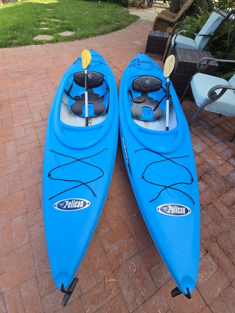 2 Pelican Sea Kayaks With Paddles