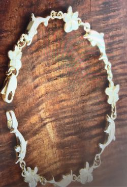 14k yellow gold dolphin and plumeria bracelet