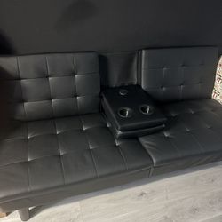 All Black Leather Futon With Two Cup Holder And A Charging Port