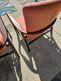 2 chairs. Burnt orange color. .