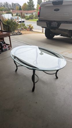Glass top coffee table with metal frame