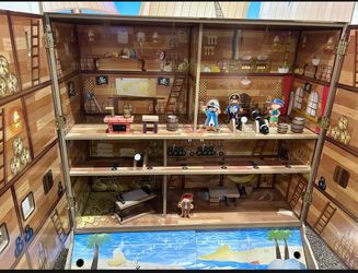 Wood pirate boat with storage on the bottom with all the figures for a perfect play for kids.