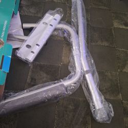 Foldable toilet safety rail