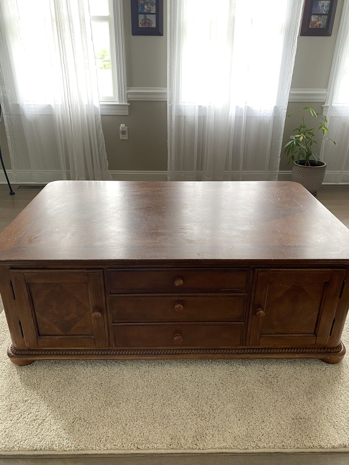 Wooden huge coffee table with ample storage compartments