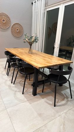 Ikea table with 8 black chairs