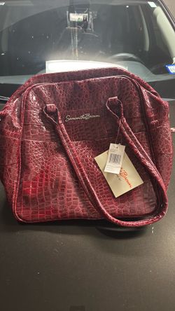 Samantha Brown red crocodile embossed travel weekender bag.