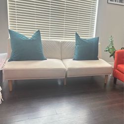 Cream sofa converted to bed