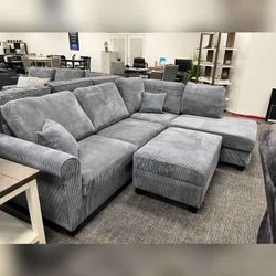 Gray corduroy sectional sofa with ottoman
