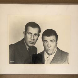 Two framed photos: Abbott and Costello and Groucho Marx