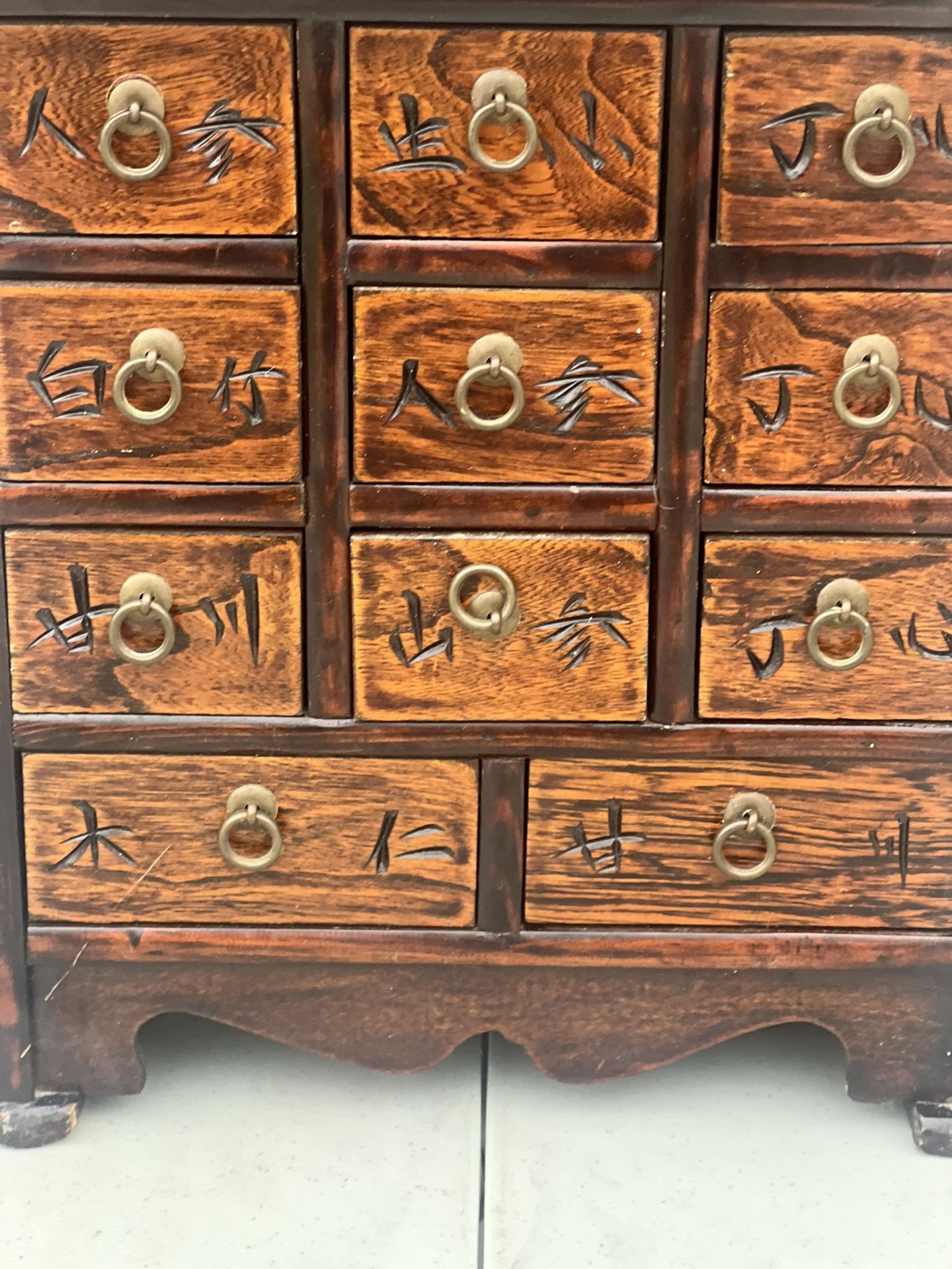 Asian Korea Wooden Brass Eleven Drawer Apothecary Chest/ Jewelry Trinket Box. Used in good condition with minor cosmetic blemishes. These blemishes ar