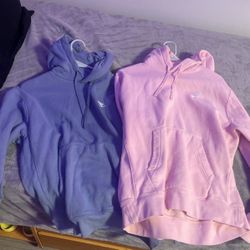 Medium Light Pink and Light Blue Nike hoodies 