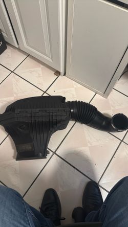 Genuine OEM Mopar engine air cleaner/intake filter box removed from a 2011–2019 Dodge Challenger.