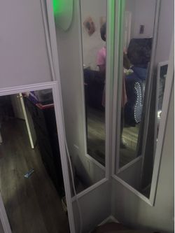 3 white boarded mirrors