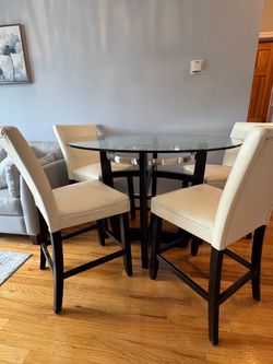 Bob’s Furniture dining set — round glass table with 4 matching cream chairs