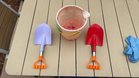 Beach shovels and castle bucket with spout