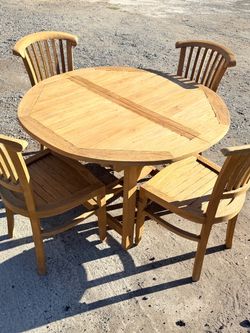 47”-66” extendable teak table and chairs