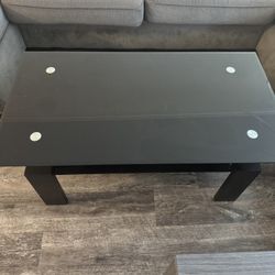 Coffee table - Black Glass & Wood Legs