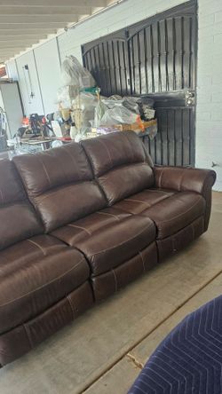 Brown leather recliner in good condition.