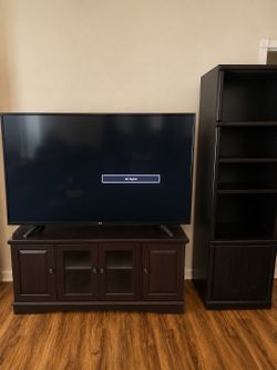 65 in tv and stand, book shelves