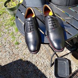 Men's dress shoes.\nBlack leather