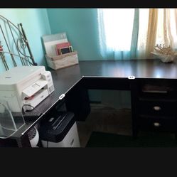 L Shaped Desk With Some desk Accessories