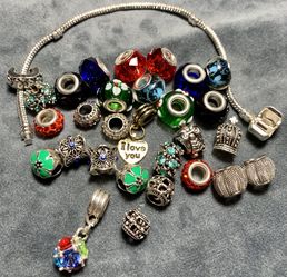 28 Charms 1 clip and a Bracelet Chain 7’’