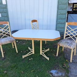 Formica Top Table and Three Cushioned Fabric Steel Chairs. 
