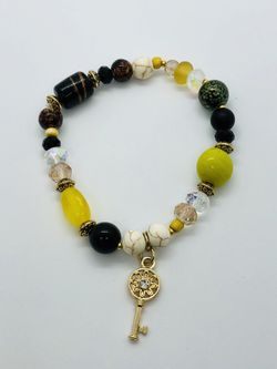 Handmade glass bead bracelet with gold charm