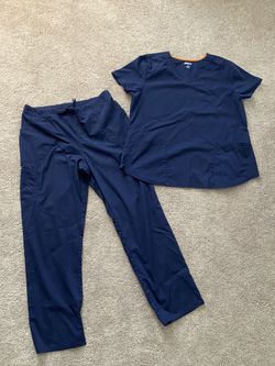 Navy blue scrubs. Pants are size large and top is XL