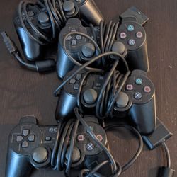 Four PS2 Dual Shock Controllers 