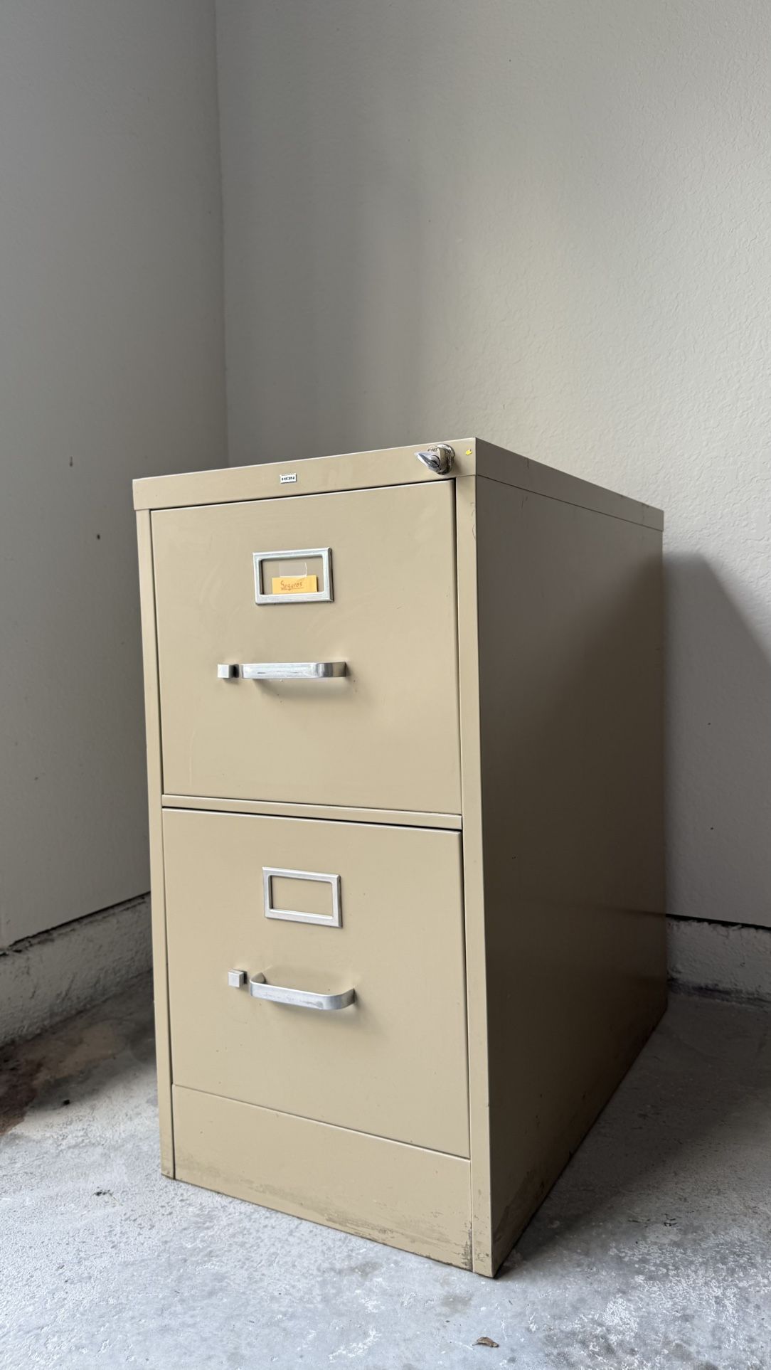 2-Drawer Metal Filing Cabinet - Perfect for Home Office! Reliable and durable 2-drawer metal filing cabinet in a neutral tan/beige color. Great for s