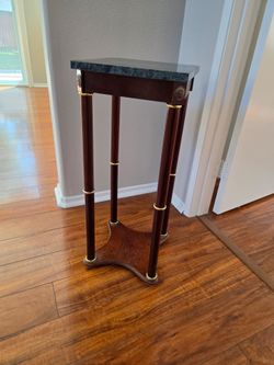 Display table with heavy stone top