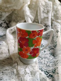 Vintage pedestal mug with bright floral art