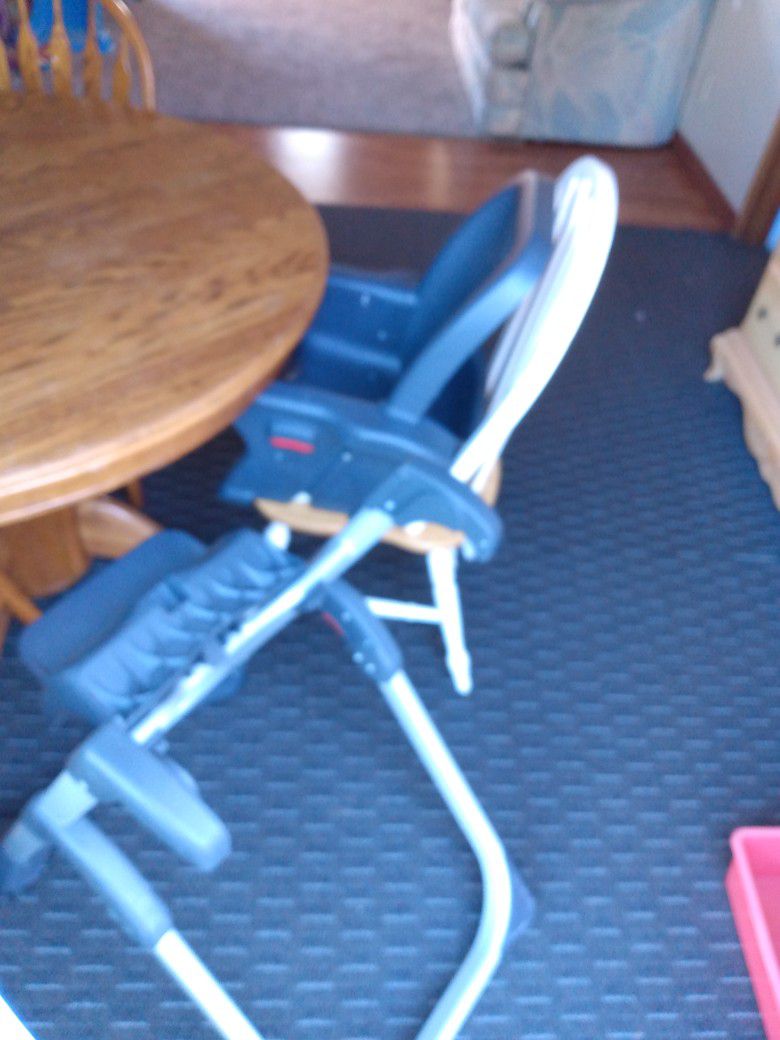 High Chair with different functions. In Very Good Condition 