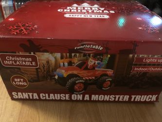 Inflatable Santa Clause on a Monster truck