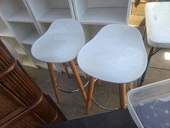 2 nice stools. With. wood legs