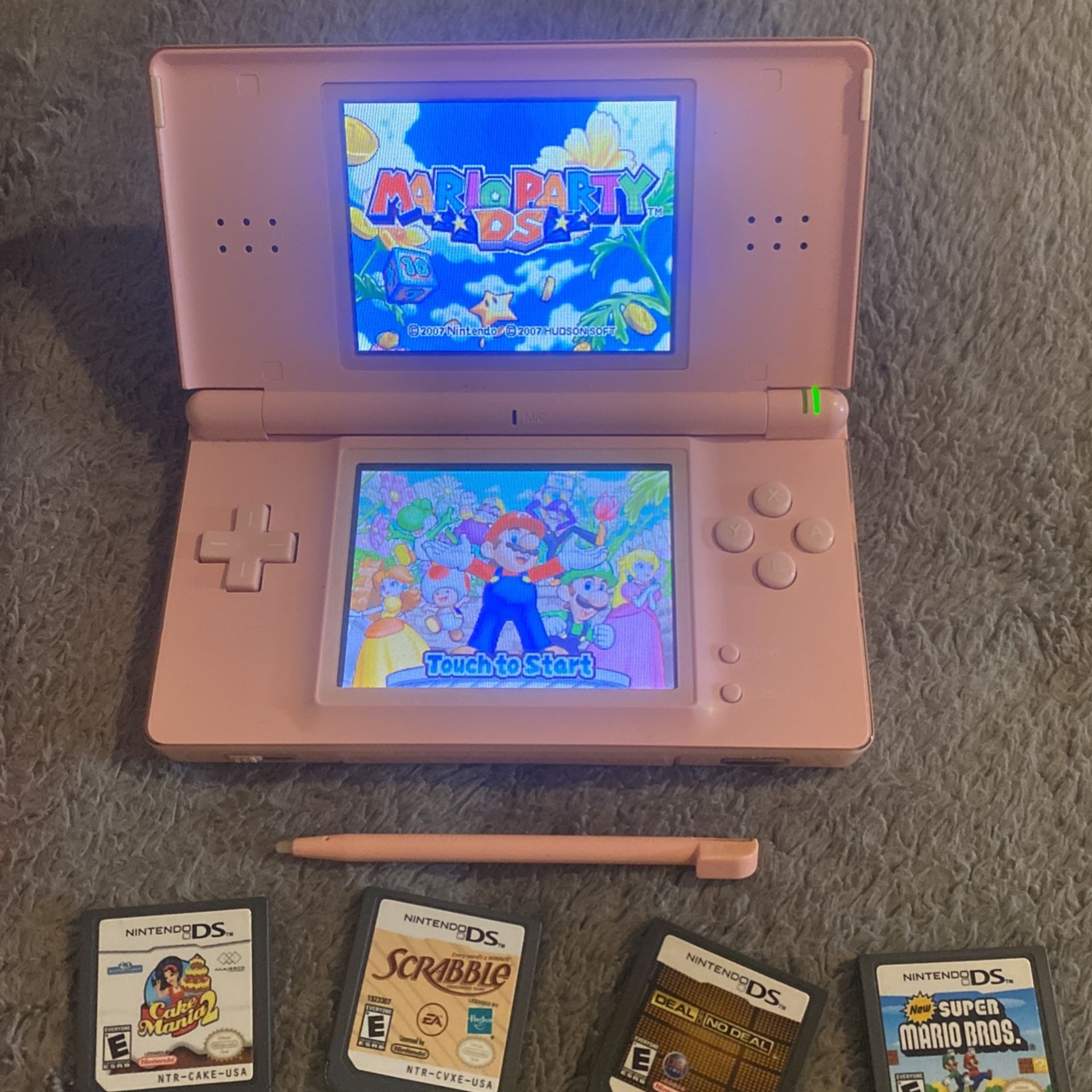 Pink Nintendo DS with Case and Games