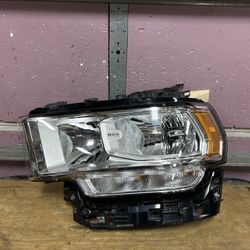 2019-2022 Dodge RAM 2500 / 3500 Left side halogen base headlight OEM