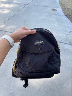 Black and gold Tush Baby hip carrier