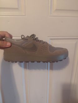 Size 13 Nike C1TY casual sneaker features a brown suede and mesh upper inspired by city life.