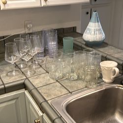 Assorted glasses, plastic wine glasses , dishes