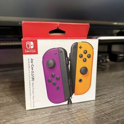 Nintendo Switch Joycons Purple and Orange