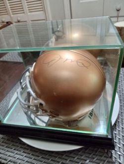 Joe Montana signed mini helmet in display case with J S.A. certificate of authenticity.