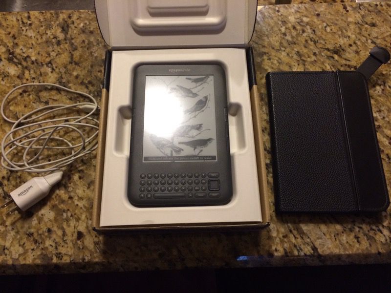Brand new Amazon Kindle with leather lighted case