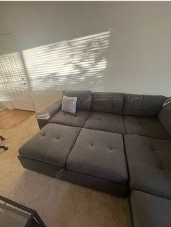 Sectional couch with storage and pull out sleeper