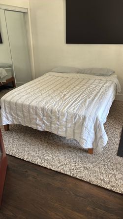 Queen size bed and wood frame.