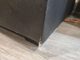 Moving black leather sofa