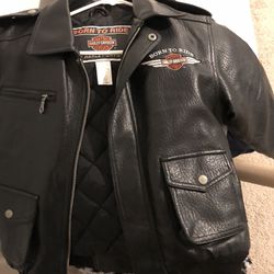 And authentic Harley Davison little leather jacket.