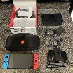 Nintendo Switch OLED – 64GB, Red & Blue Joy Cons